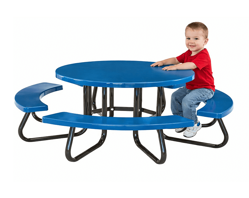 Toddler sitting at a low-profile round children’s picnic table with molded seats and sturdy steel frame for early childhood use.